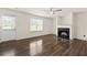 Bright living room with hardwood floors, fireplace, and a door leading to the outside at 7495 Garnet Dr, Jonesboro, GA 30236