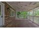 Covered back porch of a brick home at 9480 Coleman Rd, Roswell, GA 30075