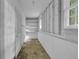Unfinished basement with shelving and natural light at 9480 Coleman Rd, Roswell, GA 30075
