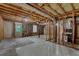 Unfinished basement with visible framing and utilities, offering potential for customization at 9480 Coleman Rd, Roswell, GA 30075