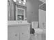Functional bathroom with a white sink, toilet, and tiled shower/bath combination at 9480 Coleman Rd, Roswell, GA 30075