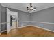 Traditional dining room with hardwood floors and updated light fixture at 9480 Coleman Rd, Roswell, GA 30075