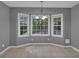 Bright dining room featuring neutral walls and floor tiles plus a beautiful bay window with great light at 9480 Coleman Rd, Roswell, GA 30075