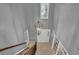 Open two story foyer with tiled floor and large chandelier at 9480 Coleman Rd, Roswell, GA 30075