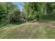 Charming home nestled among lush trees and greenery, offering a peaceful and private setting at 9480 Coleman Rd, Roswell, GA 30075