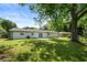 Well-maintained backyard showcasing lush green grass and mature trees at 2159 Fairburn Sw Rd, Atlanta, GA 30331