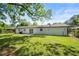 Expansive backyard featuring lush grass and a patio area at 2159 Fairburn Sw Rd, Atlanta, GA 30331
