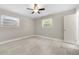 Bright bedroom with two large windows, ceiling fan, and luxury vinyl plank flooring at 2159 Fairburn Sw Rd, Atlanta, GA 30331