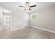 Bright bedroom featuring a ceiling fan and wood-look flooring at 2159 Fairburn Sw Rd, Atlanta, GA 30331