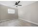 Bedroom with neutral walls, wood-look flooring and a ceiling fan at 2159 Fairburn Sw Rd, Atlanta, GA 30331