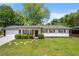 Well-kept front yard with green grass and a classic home exterior at 2159 Fairburn Sw Rd, Atlanta, GA 30331