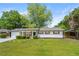 Charming home with a well-manicured front yard and mature trees at 2159 Fairburn Sw Rd, Atlanta, GA 30331
