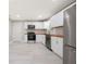 Bright kitchen featuring new stainless steel appliances, white cabinetry, and butcher block countertops at 2159 Fairburn Sw Rd, Atlanta, GA 30331