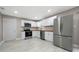 Bright kitchen featuring white cabinets, stainless steel appliances, and light wood countertops at 2159 Fairburn Sw Rd, Atlanta, GA 30331