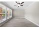 Spacious living room featuring large windows and neutral walls at 2159 Fairburn Sw Rd, Atlanta, GA 30331