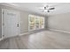 Living room with light-filled windows and neutral walls and floors at 2159 Fairburn Sw Rd, Atlanta, GA 30331