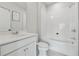 Clean bathroom featuring a tiled shower-tub combination, a modern vanity, and sleek fixtures at 2631 Creekside Nw Dr, Atlanta, GA 30318
