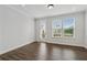 Bright bedroom with hardwood floors and a door that leads to a balcony at 2631 Creekside Nw Dr, Atlanta, GA 30318