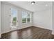 Bright bedroom with recessed lighting, wood floors, and access to a private balcony at 2631 Creekside Nw Dr, Atlanta, GA 30318