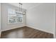 Dining room with neutral walls, contemporary lighting, and a large window at 2631 Creekside Nw Dr, Atlanta, GA 30318
