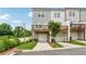Contemporary townhome exterior with private garage and rear deck under a partly cloudy sky at 2631 Creekside Nw Dr, Atlanta, GA 30318