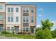 Charming two-story townhome featuring brick accents and a well-manicured lawn at 2631 Creekside Nw Dr, Atlanta, GA 30318