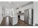 Open kitchen with stainless steel appliances, center island and recessed lighting at 2631 Creekside Nw Dr, Atlanta, GA 30318