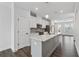 Modern kitchen with white cabinets, stainless steel appliances, and large island at 2631 Creekside Nw Dr, Atlanta, GA 30318