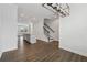 Open-concept space with wood floors, connecting living room and kitchen at 2631 Creekside Nw Dr, Atlanta, GA 30318