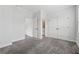 Carpeted main bedroom with a double-door closet, and open access to the Primary bathroom at 2631 Creekside Nw Dr, Atlanta, GA 30318