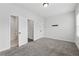 Spacious main bedroom with plush carpet, en-suite bathroom, and ample storage, designed for comfort at 2631 Creekside Nw Dr, Atlanta, GA 30318
