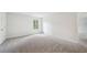 Spacious bedroom with carpeted floors and a large window, providing plenty of natural light at 3633 Squires Park Ln, Loganville, GA 30052