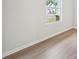 Bedroom with hardwood floors, and a window view of the neighborhood at 3633 Squires Park Ln, Loganville, GA 30052