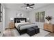 Stylishly staged bedroom with comfortable queen bed, lamps, and coordinated decor at 5383 Biffle Way, Stone Mountain, GA 30088