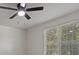 Bedroom showcasing a ceiling fan, window with blinds, and neutral-colored walls at 5383 Biffle Way, Stone Mountain, GA 30088