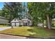 Charming two-story home with a two-car garage, manicured lawn, and mature trees at 5383 Biffle Way, Stone Mountain, GA 30088