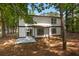 Two-story home with a patio area and wooded backyard at 5383 Biffle Way, Stone Mountain, GA 30088