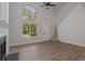 Inviting living room with high ceilings, fireplace, and generous natural light at 5383 Biffle Way, Stone Mountain, GA 30088
