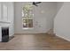 Bright and airy living room with fireplace, large window, and modern design at 5383 Biffle Way, Stone Mountain, GA 30088