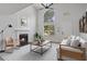 Bright living room featuring high ceilings, a fireplace, and large windows for natural light at 5383 Biffle Way, Stone Mountain, GA 30088