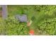 Aerial view of house featuring mature trees, gray roof, and a walkway leading to the home at 204 Morris St, Palmetto, GA 30268