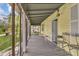 Picturesque back porch featuring comfortable seating, ideal for enjoying serene views at 204 Morris St, Palmetto, GA 30268