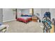 Bedroom with neutral carpet, bright light, and large closet at 204 Morris St, Palmetto, GA 30268