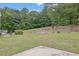 Large backyard with patio and stone landscaping at 2530 River Run Dr, Dacula, GA 30019