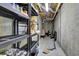 Unfinished basement for storage with shelving and concrete walls at 2530 River Run Dr, Dacula, GA 30019