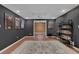 Spacious basement featuring movie themed decor and hardwood floors at 2530 River Run Dr, Dacula, GA 30019