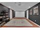 Finished basement with large projection screen and dark grey walls at 2530 River Run Dr, Dacula, GA 30019
