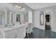 Bathroom featuring a vanity, sink, tile floor, and large mirror at 2530 River Run Dr, Dacula, GA 30019