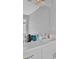 Bathroom featuring a vanity, sink, tile floor, and large mirror at 2530 River Run Dr, Dacula, GA 30019