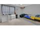 This ' bedroom features carpet flooring, a window, and room for lots of activities and play at 2530 River Run Dr, Dacula, GA 30019